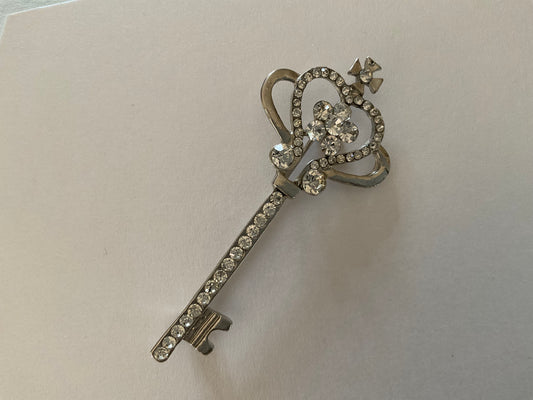 Silver tone key bar brooch